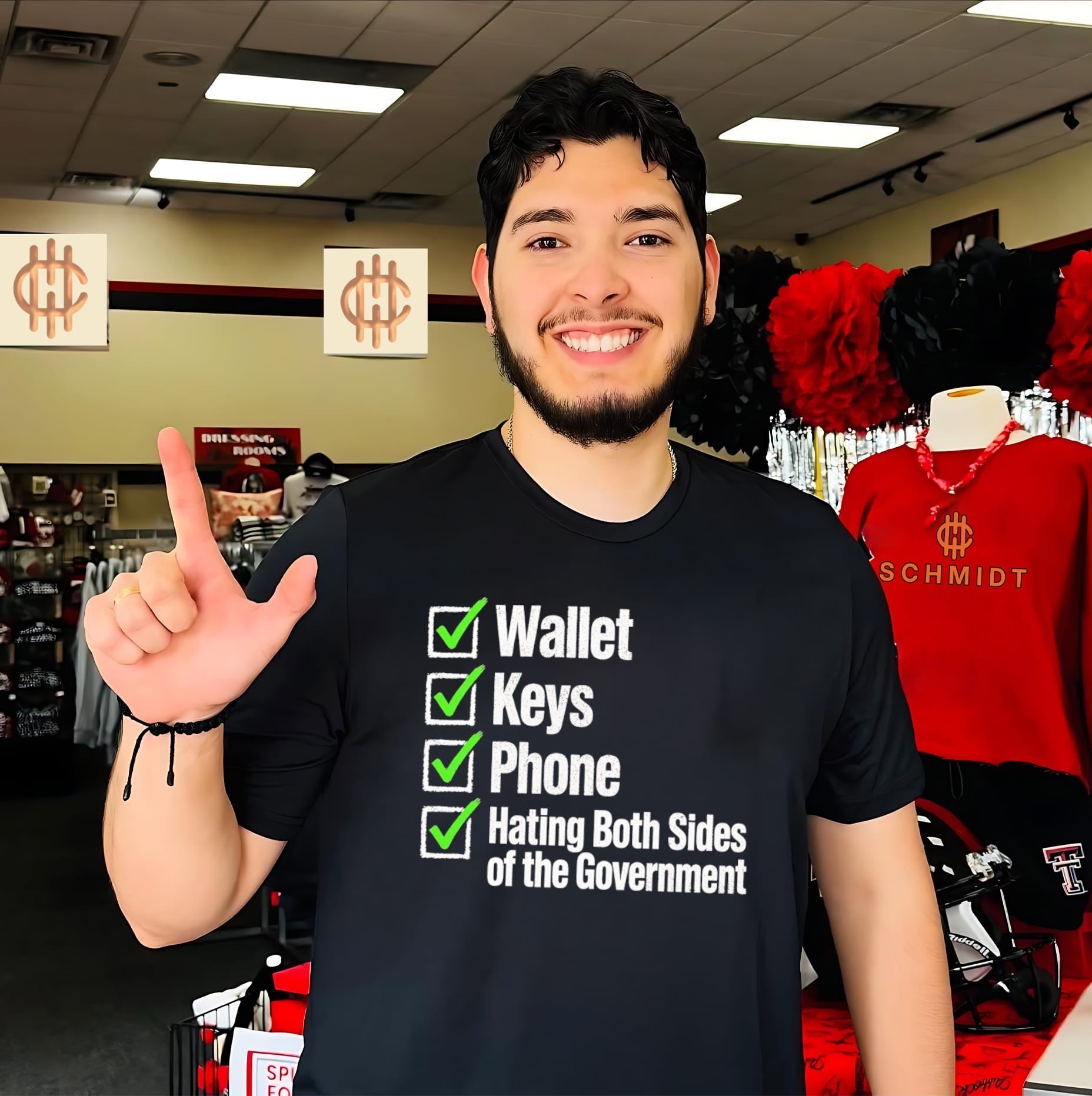 Wallet keys phone hating both sides of the Government shirt
