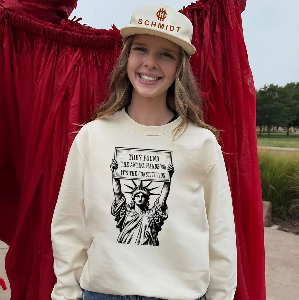 Statue of Liberty holding sign they found the antifa handbook it’s the constitution shirt